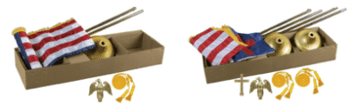 Two cardboard boxes, one with jump rope and chopsticks, the other with folded fabric and a small cross.