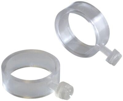 Transparent plastic ring clips with attached stems.